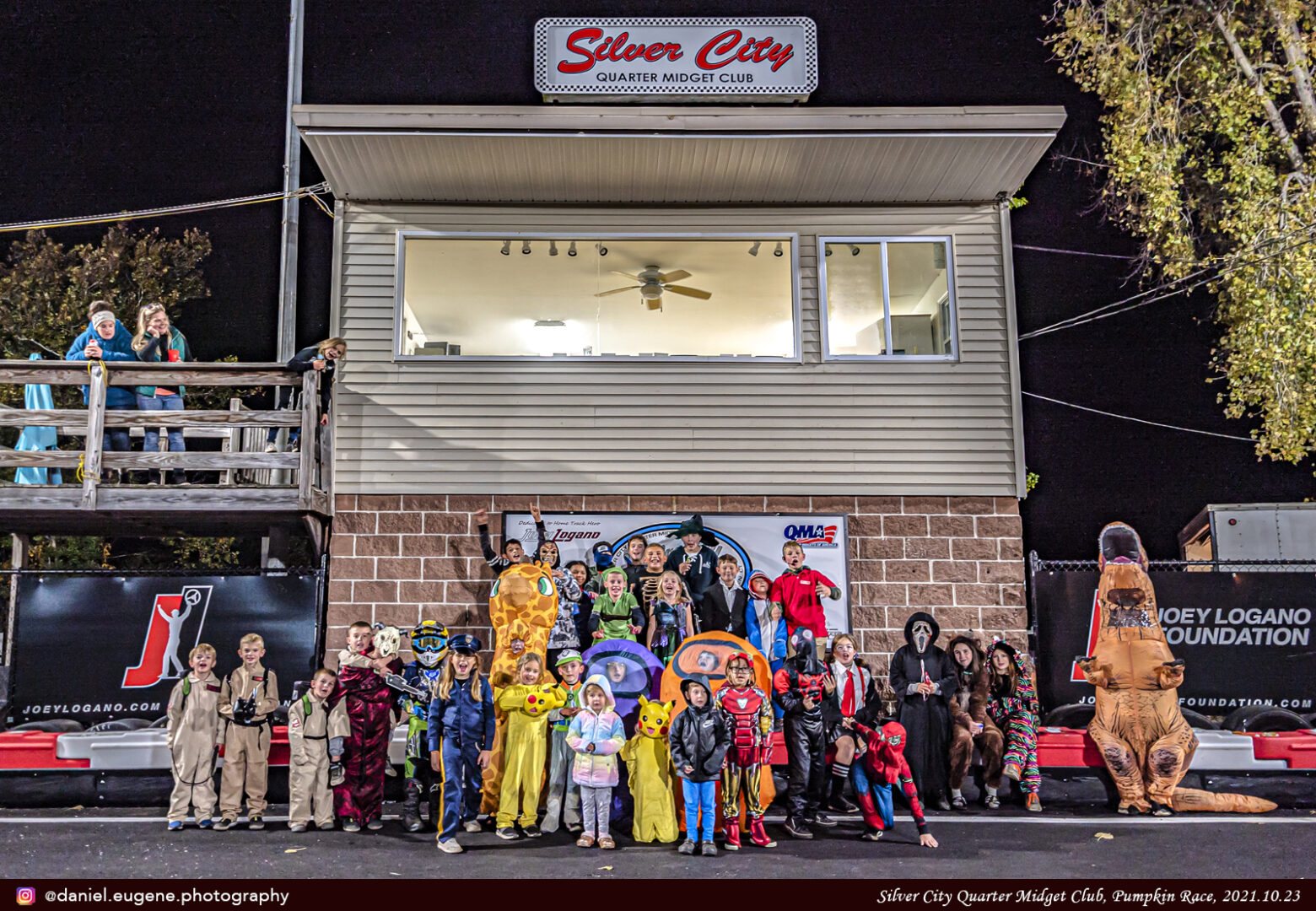 Kids With Costumes Standing Infront of Silvery City