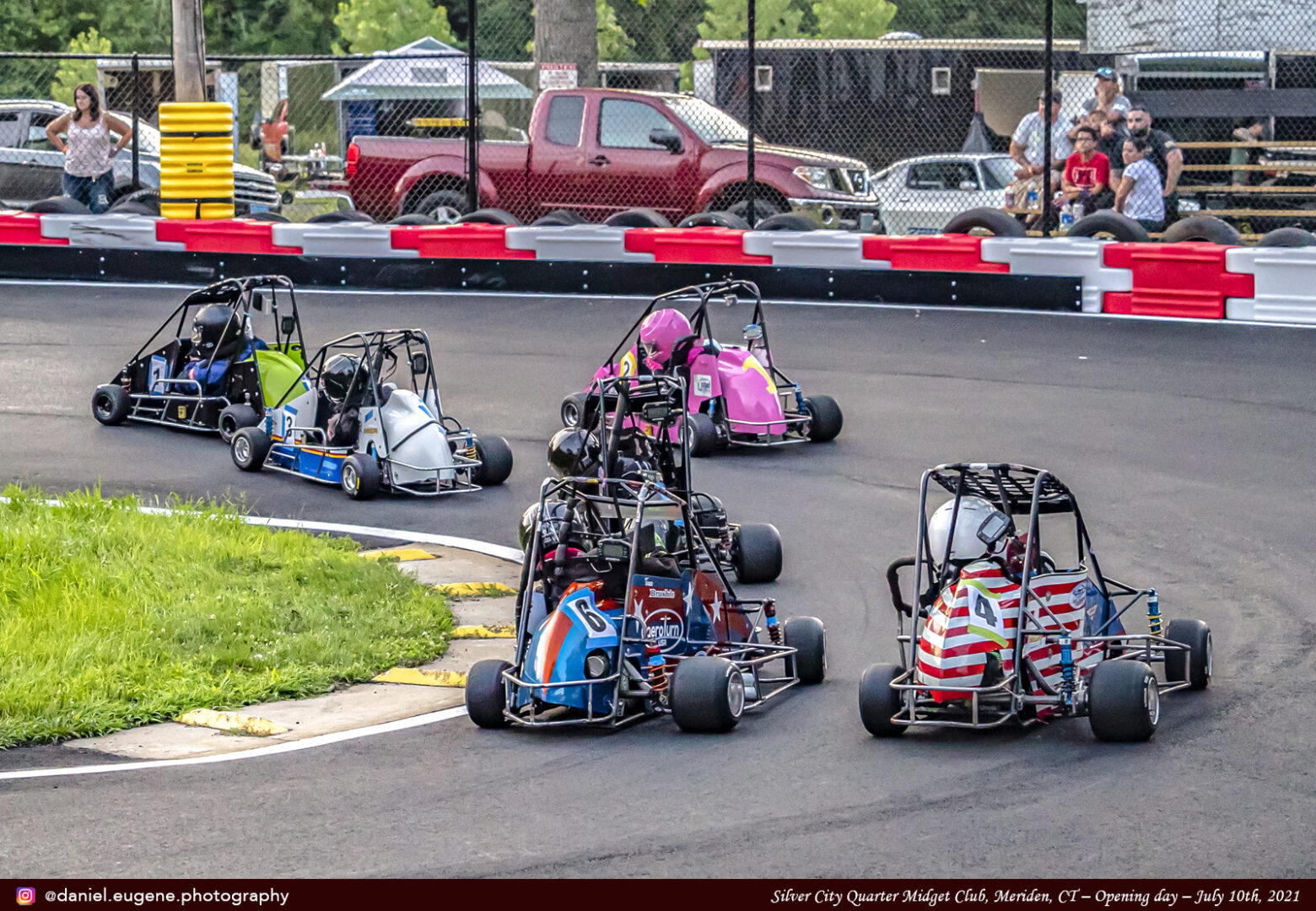 Children Turning on a Kart in a Racing Track